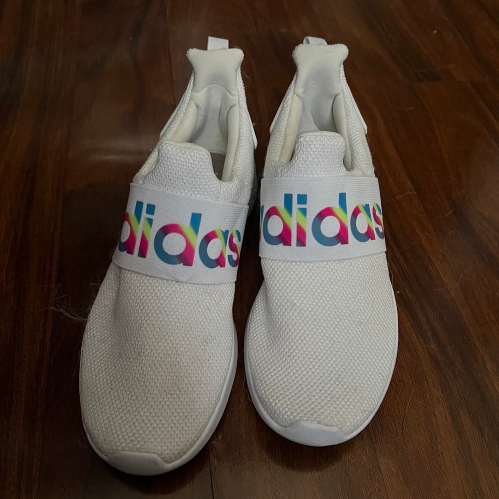 Women’s white adidas slip on sneakers